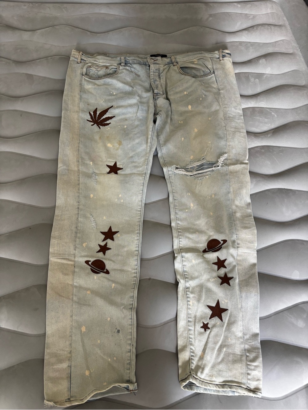 AMIRI Light Wash Jeans with Brown Celestial & Leaf Motifs